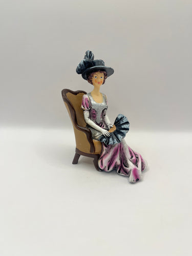 DOL157 - Resin lady with fan in chair