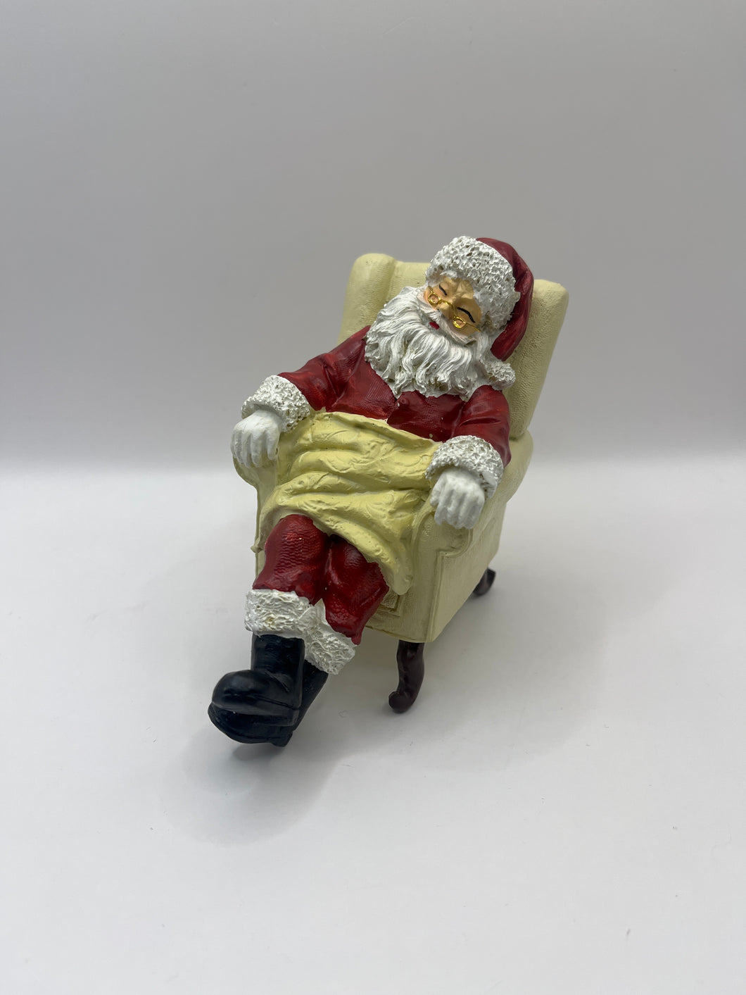 5764 - Resin sleeping Santa in armchair