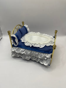 AB093 - Brass double bed with blue bedding