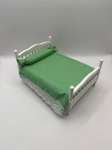 AB061 - White double bed with green bedding